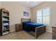 Comfortable bedroom with carpet, a ceiling fan, and a window with plantation shutters at 16420 N Thompson Peak Pkwy # 1002, Scottsdale, AZ 85260
