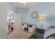 Charming bedroom with a desk, sofa, and soft blue walls providing a tranquil space at 16420 N Thompson Peak Pkwy # 1002, Scottsdale, AZ 85260