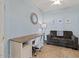 Cozy bedroom with blue walls, a desk, a couch, and neutral carpet at 16420 N Thompson Peak Pkwy # 1002, Scottsdale, AZ 85260