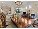 Open dining area with a wooden table and chairs, seamlessly connecting to the living spaces at 16420 N Thompson Peak Pkwy # 1002, Scottsdale, AZ 85260