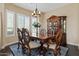 Elegant dining room featuring a wooden table, ornate chairs, and a decorative china cabinet at 16420 N Thompson Peak Pkwy # 1002, Scottsdale, AZ 85260