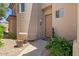 Inviting entryway with a charming door and potted plants for added curb appeal at 16420 N Thompson Peak Pkwy # 1002, Scottsdale, AZ 85260