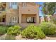 Multi-story home with a balcony and patio surrounded by desert landscaping at 16420 N Thompson Peak Pkwy # 1002, Scottsdale, AZ 85260