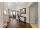 Elegant foyer with hardwood floors, a staircase, and entry to the dining room at 16420 N Thompson Peak Pkwy # 1002, Scottsdale, AZ 85260