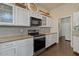 Modern kitchen features sleek appliances, white cabinetry, and ample countertop space at 16420 N Thompson Peak Pkwy # 1002, Scottsdale, AZ 85260