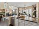 Gourmet kitchen with granite countertops, modern appliances, and a seamless flow to the living spaces at 16420 N Thompson Peak Pkwy # 1002, Scottsdale, AZ 85260