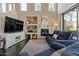 Bright living room features hardwood floors, a fireplace, and comfortable seating at 16420 N Thompson Peak Pkwy # 1002, Scottsdale, AZ 85260