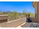 Outdoor patio area featuring a beautiful view of the mountains, an iron railing, and clear blue skies at 16420 N Thompson Peak Pkwy # 1002, Scottsdale, AZ 85260