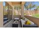 Comfortable outdoor sofa and coffee table on a shaded outdoor patio at 16420 N Thompson Peak Pkwy # 1002, Scottsdale, AZ 85260