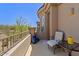 Outdoor patio featuring an iron railing, a side table, and clear blue skies at 16420 N Thompson Peak Pkwy # 1002, Scottsdale, AZ 85260