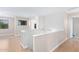 Bright upstairs hallway with wood-look floors and open landing at 16527 W Ironwood St, Surprise, AZ 85388