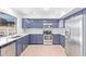 Modern kitchen with stainless appliances, granite countertops, and lots of cabinets at 16527 W Ironwood St, Surprise, AZ 85388