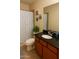 Bathroom featuring a vanity with a granite countertop and a shower with blue patterned curtains at 16820 E La Montana Dr # 105, Fountain Hills, AZ 85268