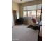 Bright bedroom with large window, and carpet at 16820 E La Montana Dr # 105, Fountain Hills, AZ 85268