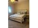 Comfortable bedroom features neutral colors, nice furnishings, carpet, and a window at 16820 E La Montana Dr # 105, Fountain Hills, AZ 85268