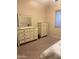 Bedroom with dressers, mirror, and a serene atmosphere at 16820 E La Montana Dr # 105, Fountain Hills, AZ 85268