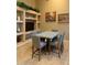 Stylish dining area boasts a modern table, seating for six, and contemporary decor on display shelving at 16820 E La Montana Dr # 105, Fountain Hills, AZ 85268