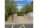 Well-kept community featuring lush green landscaping, manicured trees, and convenient mailbox access at 16820 E La Montana Dr # 105, Fountain Hills, AZ 85268