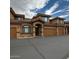 Attractive townhome with a well-kept exterior, a tiled roof, and convenient garage access at 16820 E La Montana Dr # 105, Fountain Hills, AZ 85268