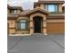 Charming townhouse featuring a well-maintained facade and a covered entrance, complemented by desert landscaping at 16820 E La Montana Dr # 105, Fountain Hills, AZ 85268