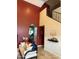 Bright living room with a soaring ceiling, arched doorway, and staircase at 16820 E La Montana Dr # 105, Fountain Hills, AZ 85268