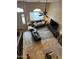 Spacious living room from above with comfortable seating, a ceiling fan, and a large entertainment center at 16820 E La Montana Dr # 105, Fountain Hills, AZ 85268