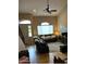 Cozy living room features comfortable seating, a ceiling fan, a large window, and stylish decor at 16820 E La Montana Dr # 105, Fountain Hills, AZ 85268