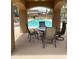 Charming pool view through archway, furnished with table and chairs, perfect for relaxation at 16820 E La Montana Dr # 105, Fountain Hills, AZ 85268