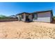 Backyard view showcasing a covered patio and space ready for customization at 18021 W Avenida Del Sol --, Surprise, AZ 85387