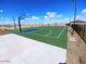 Community basketball court with multiple hoops, perimeter lighting, and lush surroundings at 18021 W Avenida Del Sol --, Surprise, AZ 85387