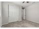 Bedroom featuring neutral walls, carpeted floors, a ceiling fan, and a closet with sliding doors at 18021 W Avenida Del Sol --, Surprise, AZ 85387
