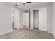 Bedroom featuring neutral walls, carpeted floors, a ceiling fan, and a closet with sliding doors at 18021 W Avenida Del Sol --, Surprise, AZ 85387