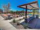 Bocce ball court featuring lounge chairs and bench seating underneath a sun shelter at 18021 W Avenida Del Sol --, Surprise, AZ 85387