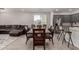 Enjoy meals in the elegant dining area with wood table and chairs, open to the kitchen and living spaces at 18021 W Avenida Del Sol --, Surprise, AZ 85387