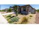 Attractive front yard with desert landscaping, stone pillars, and a well-maintained facade at 18021 W Avenida Del Sol --, Surprise, AZ 85387