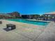Community pool featuring lounge areas, cabanas, and clear blue water, perfect for relaxation and recreation at 18021 W Avenida Del Sol --, Surprise, AZ 85387