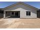Exterior of home featuring a backyard and covered patio at 18165 W Larkspur Dr, Goodyear, AZ 85338