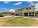 Large backyard with a green lawn, stone, and manicured garden, perfect for outdoor relaxation at 1915 S Ponderosa Dr, Gilbert, AZ 85295