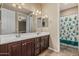 Bathroom featuring a double vanity, dark wood cabinets and a shower with a frog-themed curtain at 1915 S Ponderosa Dr, Gilbert, AZ 85295