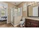 Well-lit bathroom featuring a stand-up glass shower, neutral paint and granite vanity at 1915 S Ponderosa Dr, Gilbert, AZ 85295