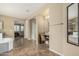 Bathroom with a soaking tub, dual sinks, a vanity area, and access to the bedroom and shower at 1915 S Ponderosa Dr, Gilbert, AZ 85295
