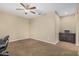 Neutral bedroom with carpet flooring, a ceiling fan, and built-in dark cabinets at 1915 S Ponderosa Dr, Gilbert, AZ 85295