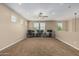 Large bonus room with carpet flooring, windows, and ceiling fan, ideal for entertaining at 1915 S Ponderosa Dr, Gilbert, AZ 85295