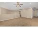 Bonus room with carpet flooring and neutral walls, hallway can be seen to the left at 1915 S Ponderosa Dr, Gilbert, AZ 85295