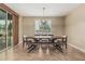 Elegant dining room featuring a modern table with stylish seating and a contemporary light fixture at 1915 S Ponderosa Dr, Gilbert, AZ 85295