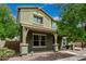 Inviting home exterior featuring a covered front porch and lush landscaping, creating a welcoming ambiance at 1915 S Ponderosa Dr, Gilbert, AZ 85295