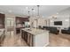 This modern kitchen has stainless steel appliances, a large island, and opens to the living room at 1915 S Ponderosa Dr, Gilbert, AZ 85295