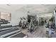 Well-equipped gym featuring modern treadmills, elliptical machines, weights, and mirrored wall at 2025 E Campbell Ave # 107, Phoenix, AZ 85016
