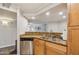 This kitchen features stainless steel appliances, granite countertops, and seamless access to the adjacent living spaces at 2025 E Campbell Ave # 107, Phoenix, AZ 85016