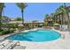 Beautiful community pool area boasts desert landscaping, lounge seating, and nearby buildings at 2025 E Campbell Ave # 107, Phoenix, AZ 85016